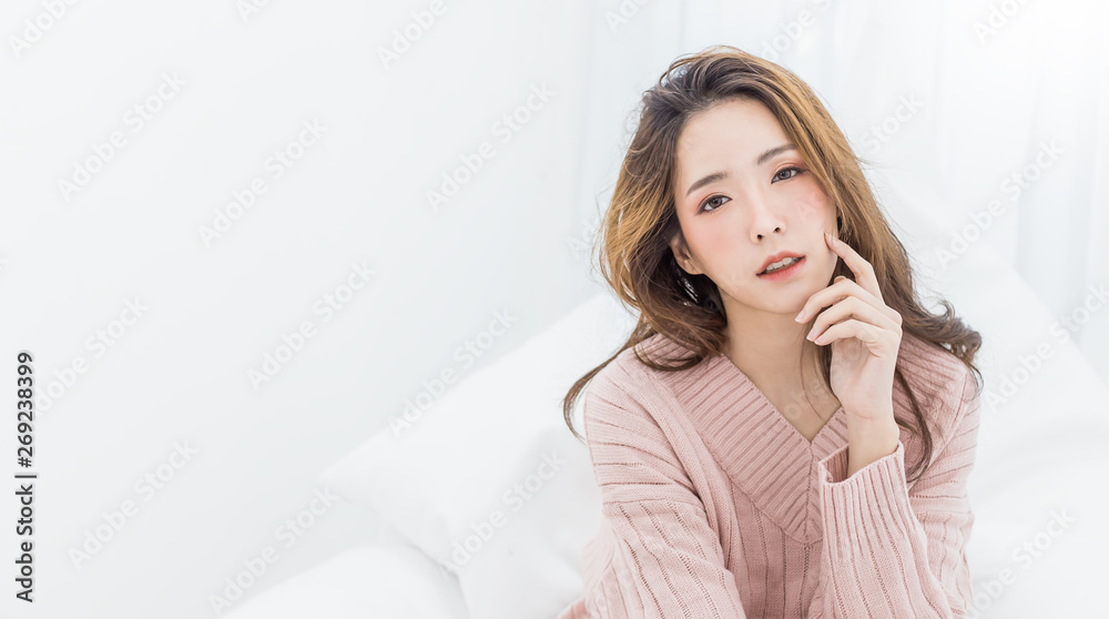 Portrait of young beautiful sexy asian woman relax in her bedroom. Smile happy face asian girl isolated on white background. Beauty treatment perfect clear skin japanese makeup  lifestyle concept - obrazy, fototapety, plakaty 
