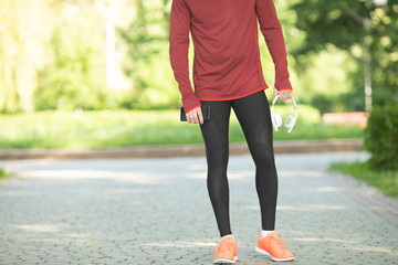 Wall Mural - Male runner running on road training for fitness. Man doing jogging workout run outside in summer in nature