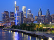 Philadelphia skyline at night with the Schuylkill River on the foreground