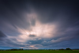 Fototapeta Tęcza - Image of dark Storm clouds in the field
