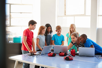 Wall Mural - Group Of Students In After School Computer Coding Class Learning To Program Robot Vehicle