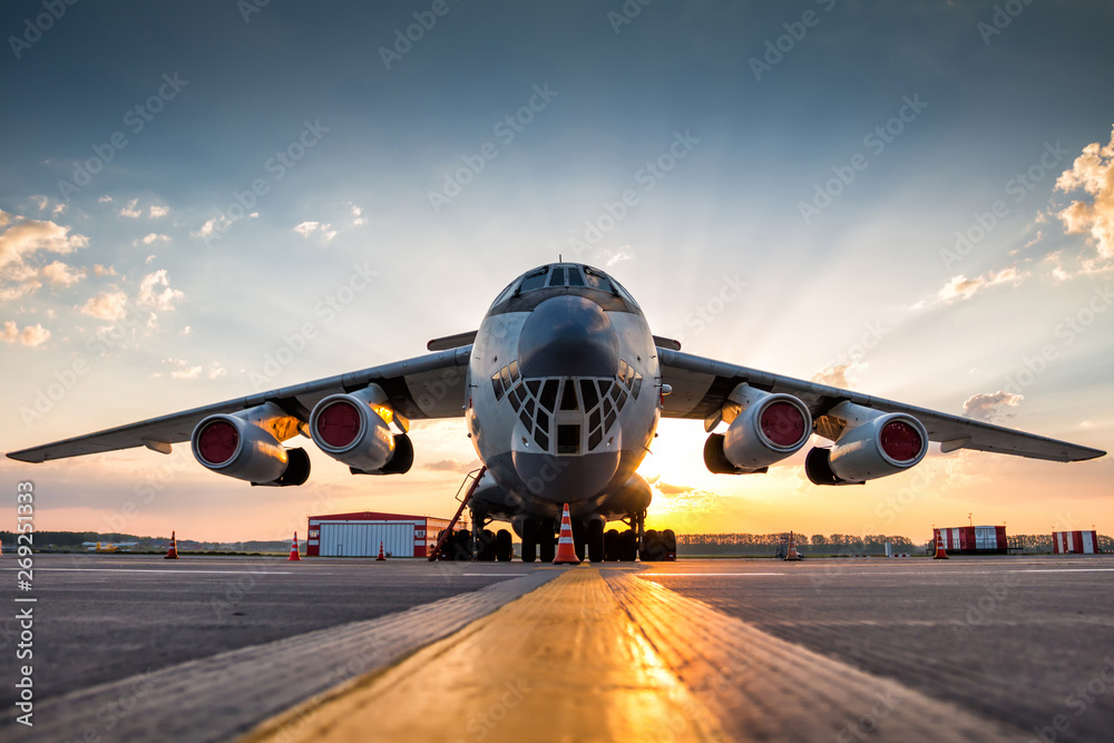 Wide body transport cargo aircraft at airport apron in the morning sun - obrazy, fototapety, plakaty 