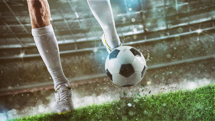 Football scene at night match with player ready to shoot the ball