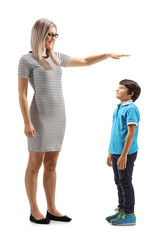 Wall Mural - Woman gesturing with hand and showing the height of a young boy