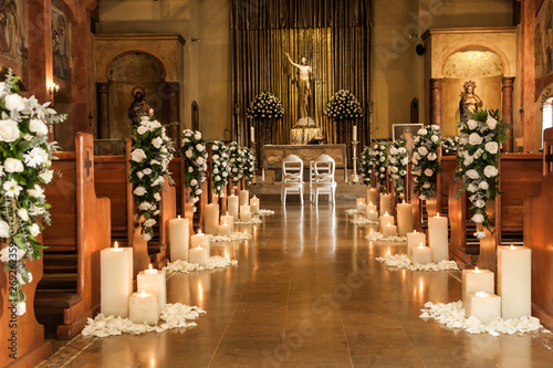Fotomural Catholic temple decorated with flowers and candles for wedding