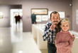 © JackF - Father and daughter looking at paintings in halls of museum