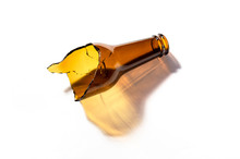 Glass Beer Bottle Broken In Half Isolated On White Background. Opaque Glass Bottle Of Brown Color Cracked. Improvised Weapon.