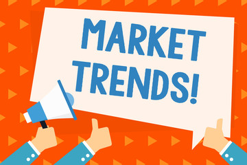 Word writing text Market Trends. Business photo showcasing Changes and developments in buying and selling in the market Hand Holding Megaphone and Other Two Gesturing Thumbs Up with Text Balloon