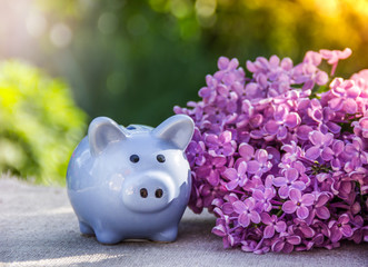 Piggy bank on the table. Blue piggy bank