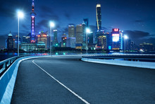 High Speed Corner Overpass Asphalt Road With Shanghai Cityscape , Night Scene .