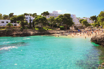  Beautiful Cala d'Or Beach in sunny summer day with turquoise water. Beach Cala Gran in Cala d'Or, Mallorca, Spain.
