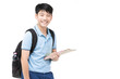 © sirikorn - Smiling little student boy in blue polo t-shirt in with books and bag.