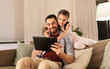 © Syda Productions - family, fatherhood and technology concept - happy father and little daughter with tablet pc computer at home