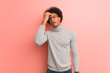 Wall Mural - Young african american man over a pink wall worried and overwhelmed