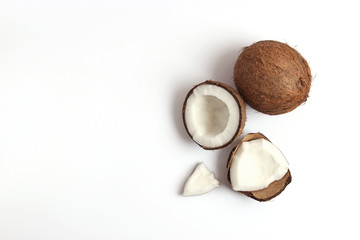 broken coconut on a white background top view.