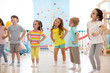 Group of children are engaged indoor physical exercise