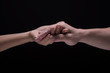 © montira - Hand hold together mean be in take care, agreement,power and friendship.