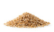 Heap of dry wheat groats on a white background, isolated.