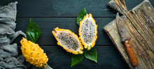 Yellow Pytahya On A Black Background. Fruit Dragon. Tropical Fruits. Top View. Free Space For Text.