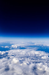 Wall Mural - Wonderful view of cloudscape with clear blue sky from above.