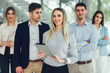 © Mediteraneo - Group of happy business people and company staff in modern office, representig company