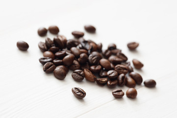Poster - Coffee  beans isolated on white background with copyspace for text. Coffee background or texture concept.