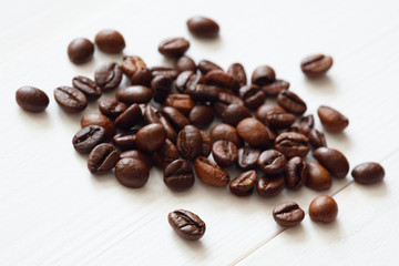 Poster - Coffee  beans isolated on white background with copyspace for text. Coffee background or texture concept.