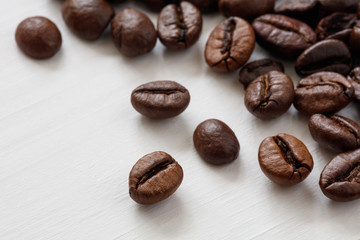 Poster - Coffee  beans isolated on white background with copyspace for text. Coffee background or texture concept.
