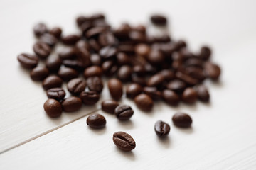 Poster - Coffee  beans isolated on white background with copyspace for text. Coffee background or texture concept.