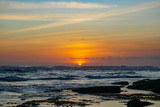 Fototapeta Niebo - Sunset view from beach near Tanah Lot Temple in Bali Indonesia