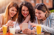 © ivanko80 - Girls having fun in cafe