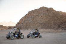 Extreme Buggy Races At Sunset Near The Mountains And A Bedouin Village In The Desert Near Hurghada. Egypt