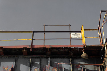 Wall Mural - Catwalks against a gray sky, American industrial site, horizontal aspect