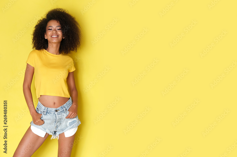 Close up of a happy afro model laughing and looking at the side. - obrazy, fototapety, plakaty 