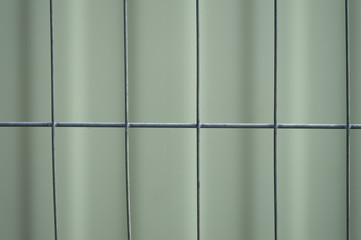 Close-up of metal wire fence. Abstract background.