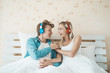 © Johnstocker - Happy couple listening song in the morning at bedroom