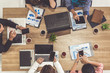 © InfiniteFlow - Top view of businessman executive in group meeting with other businessmen and businesswomen in modern office with laptop computer, coffee and document on table. People corporate business team concept.