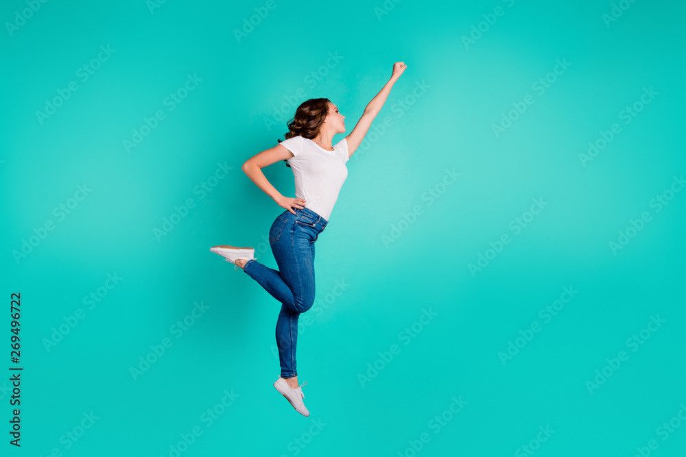 Full length body size profile side view of her she nice-looking attractive cheerful slim fit thin slender wavy-haired lady raising hand up aim isolated on bright vivid shine blue background - obrazy, fototapety, plakaty 