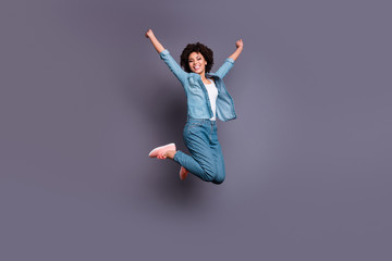 Sticker - Full length side profile body size photo beautiful she her dark skin lady jump high arms hands raised up air champion triumphant glory luck wear casual jeans denim shirt isolated grey background