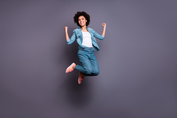 Canvas Print - Full length body size photo beautiful she her dark skin lady jump high arms hands raised up air champion triumphant glory luck yeah wear casual jeans denim shirt isolated grey background