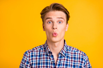 Wall Mural - Close up photo amazing youngster he him his man excited look wondered lips mouth perfect ideal o shape figure form wear casual plaid checkered shirt outfit isolated yellow bright background