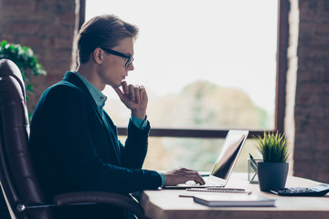 Profile side view photo focused pensive collar touch chin thoughtful ponder look develop start-up marketing document true specialist suit black jacket sit desk table brunette industrial loft studio