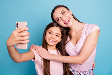 Canvas Print - Close-up portrait of two nice cute charming attractive lovely sweet gorgeous cheerful cheery straight-haired girls taking making selfie isolated on bright vivid shine green blue turquoise background