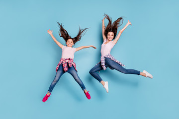 Poster - Full length body size view portrait of two nice attractive cheerful cheery careless carefree healthy straight-haired girls having fun rejoicing isolated on bright vivid shine blue turquoise background