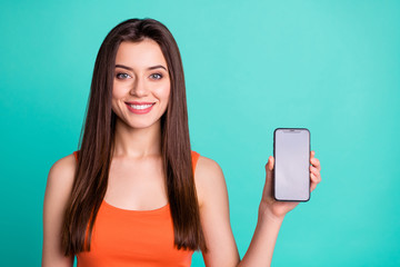 Wall Mural - Portrait of cute charming pretty lady youth have modern technology advertise advise advice decision choice satisfied content enjoy feedback wear fashionable nice outfit isolate turquoise background