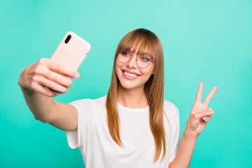 Canvas Print - Close up photo amazing beautiful she her lady arm hand hold telephone make take selfies v-sign symbol positive friendly speak tell skype wear specs casual white t-shirt isolated teal green background