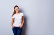© deagreez - Close up photo beautiful amazing she her lady hands arms denim pants pockets self-confident easy-going reliable business person wondered look wear casual white t-shirt isolated grey background