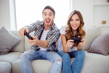 Portrait Of His He Her She Two Person Nice-looking Attractive Lovely Cheerful Cheery Positive Guy Lady Playing Online Station Having Fun In Light White Style Interior Hotel House Indoors