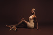 © LIGHTFIELD STUDIOS - beautiful sensual african american woman with short hair on brown