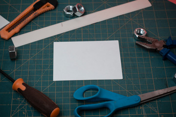 Poster - Carpentry equipments and plain paper scattered everywhere on measuring mat